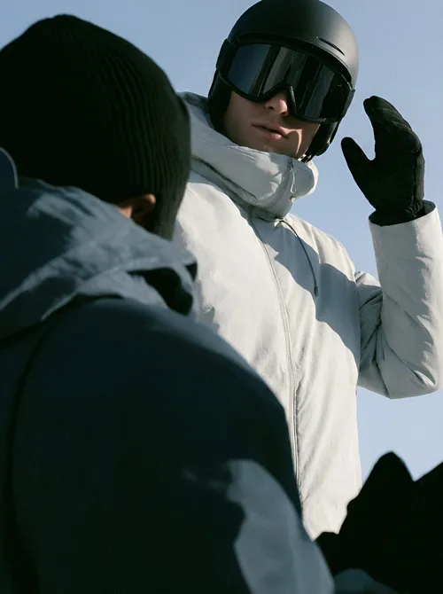 Skier greeting on snowy slope.